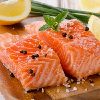 A fresh salmon on a cutting board