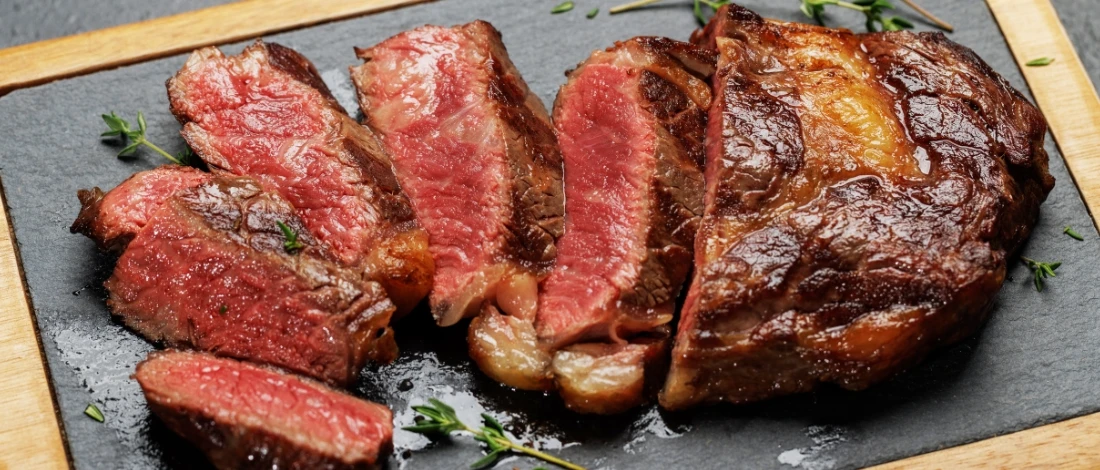 A top view of perfectly cooked ribeye steak from an air fryer