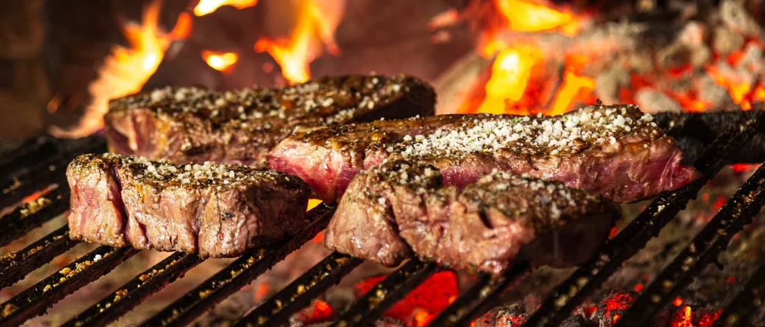 A sliced meat on a griller