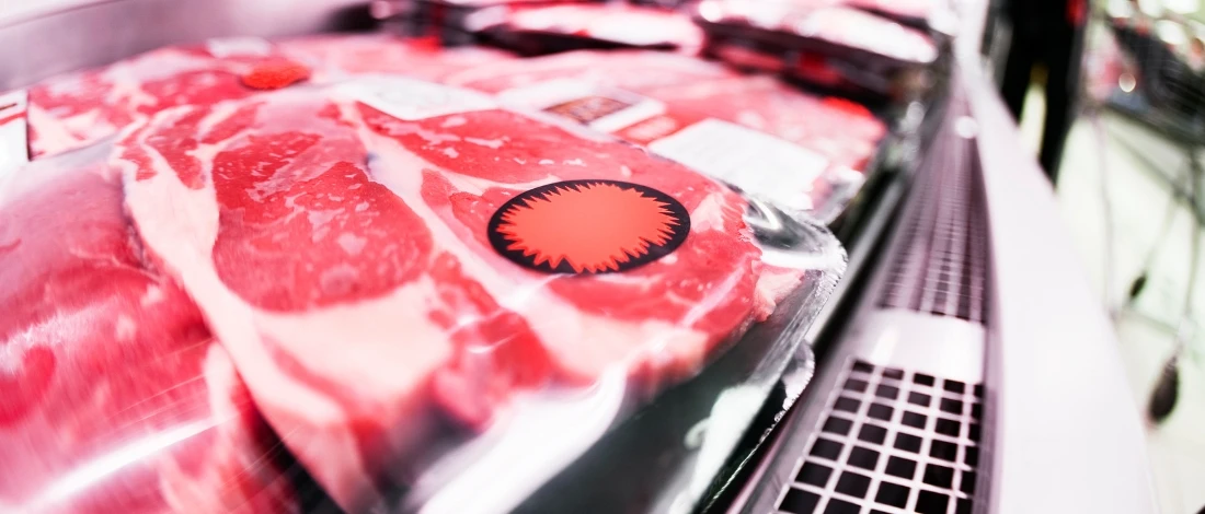A close up shot of packed meat in a grocery
