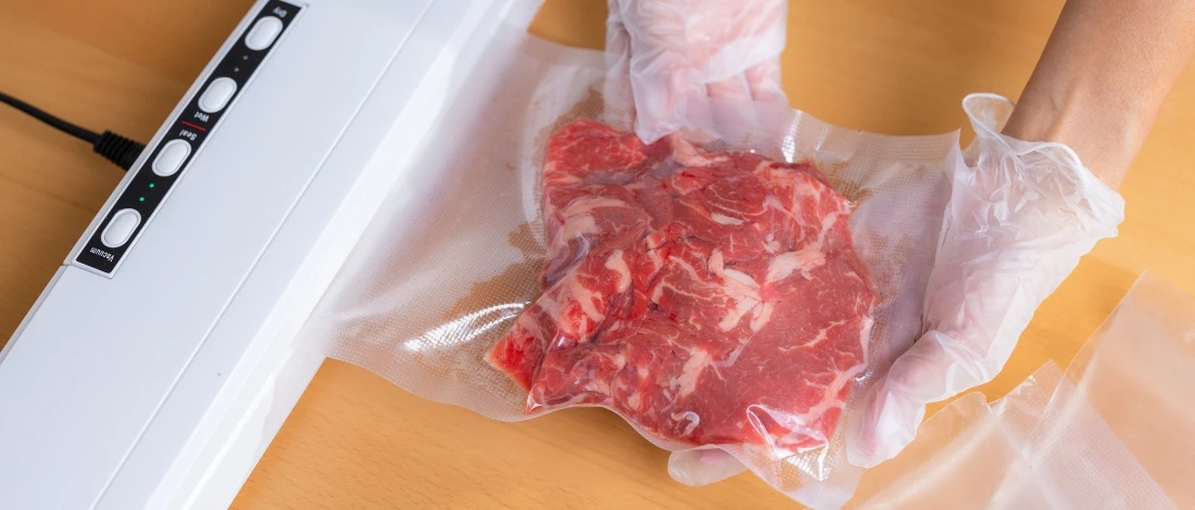 A person packing the meat
