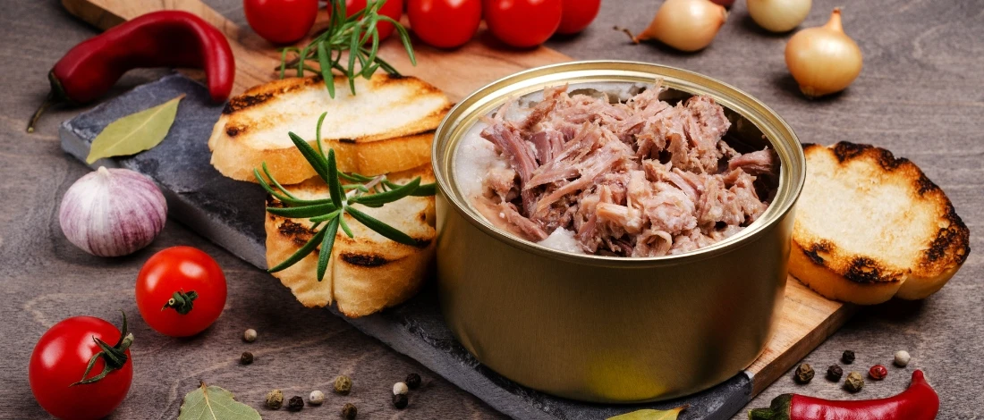 A canned beef with veggies on the side