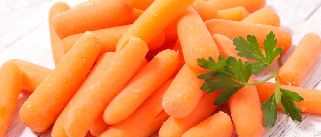 A close up shot of baby carrots