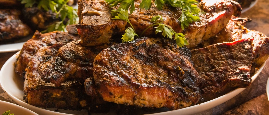 A cooked meats on the plate