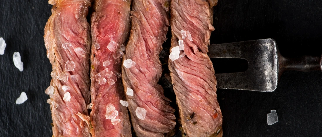 A sliced medium rare steak