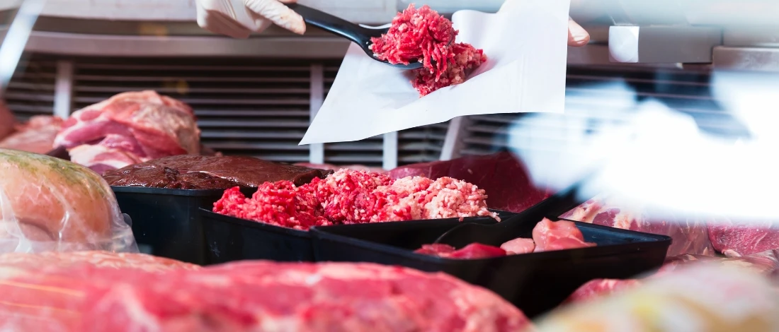 The raw meat in the chiller in a grocery store