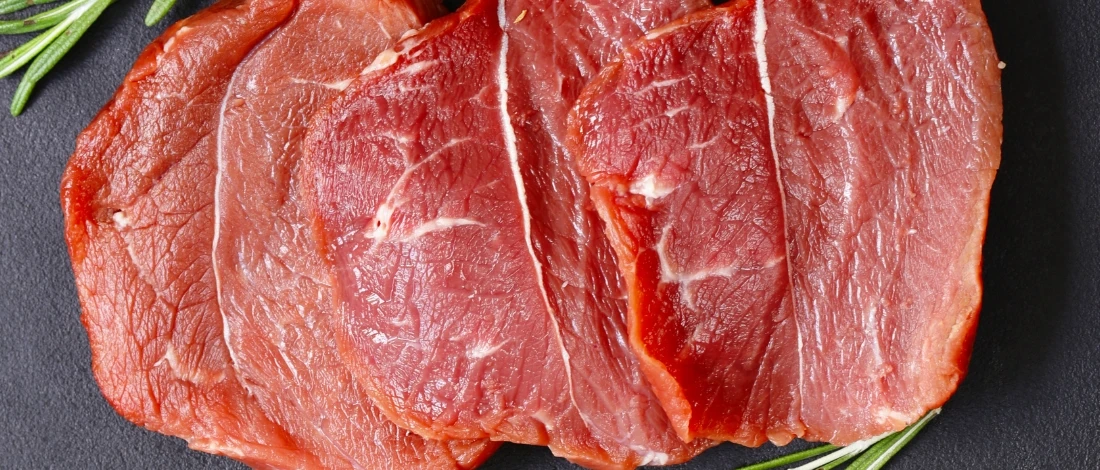 A raw meat sliced thinly