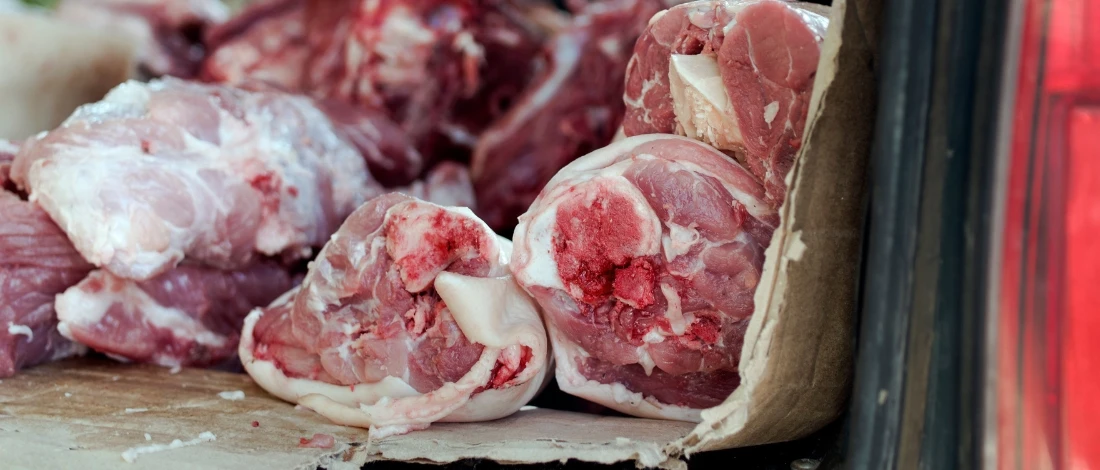 The raw meats in a car trunk