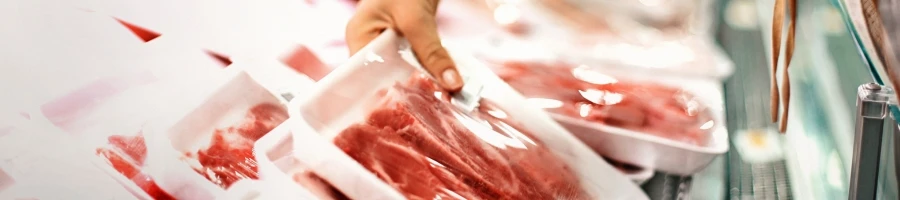 A person choosing a fresh meat