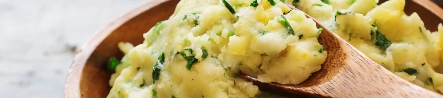 A mashed potato with spoon