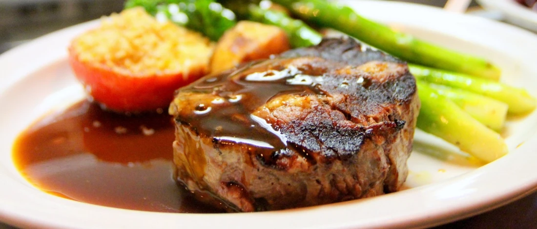 A delicious steak with bourbon sauce