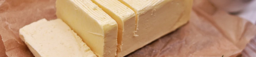 A sliced of a softened butter as part of Cajun Steak Butter Recipe