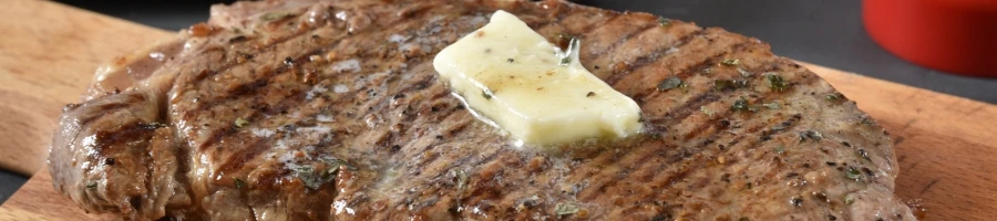 A steak with a melting butter on top
