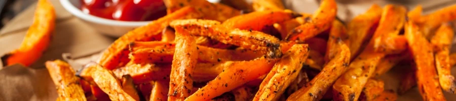 Crispy sweet potato fries on the table