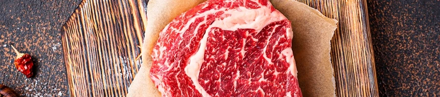 A raw ribeye steak