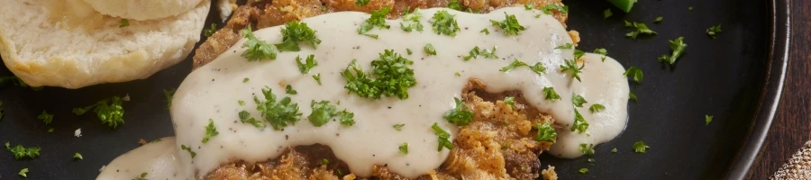 Chicken fried steak topped with country gravy