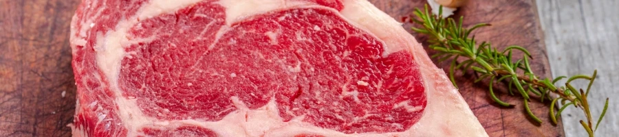 A raw ribeye steak
