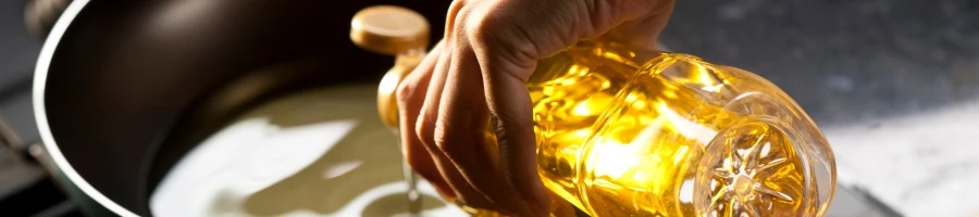 Pouring cooking oil into the pan