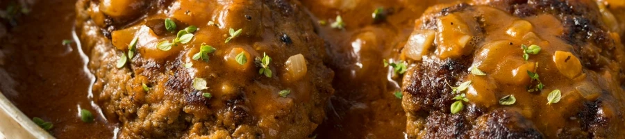 Two pieces of beef patties with mushrooms