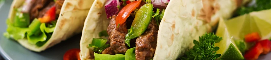A taco full of different ingredients