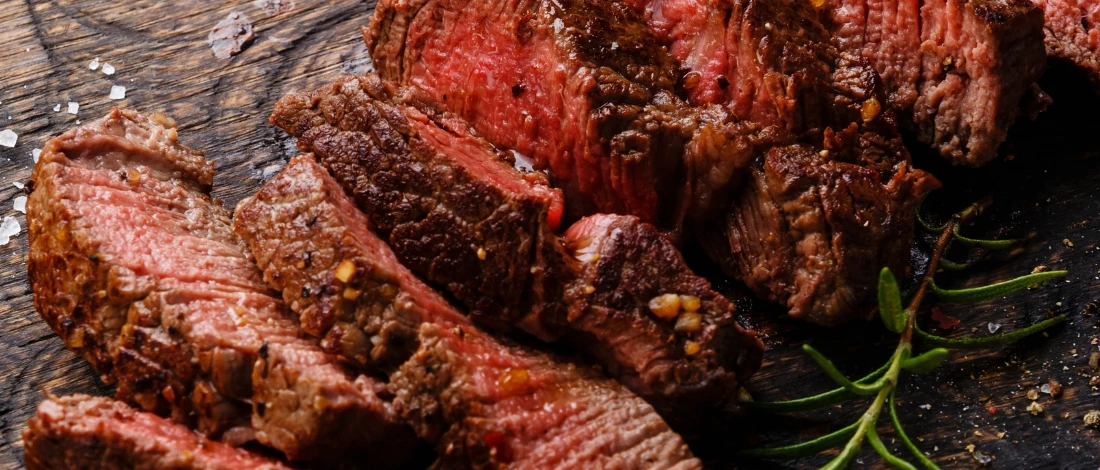 A top view of sliced medium rare steak