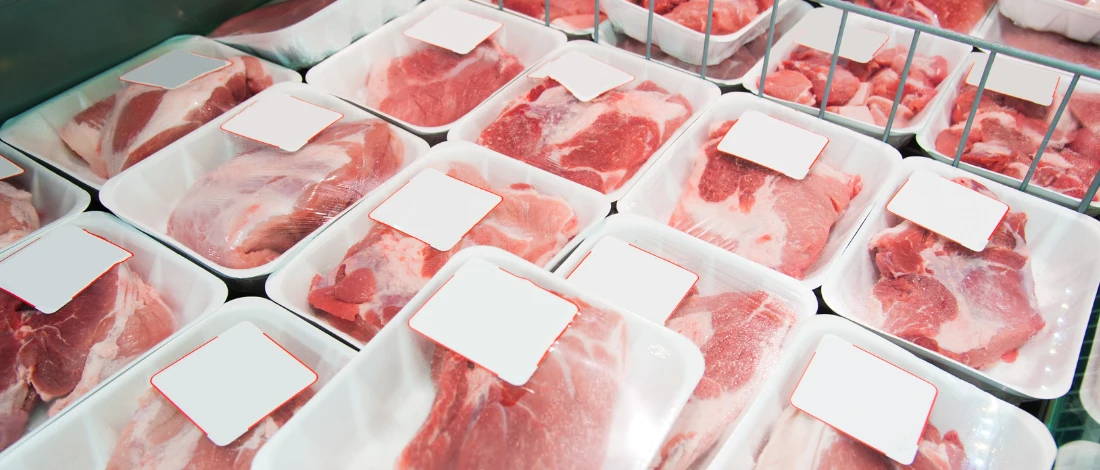 Meat packed on table to be moved out